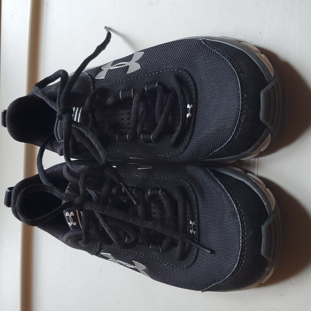 Youth size 5 Under Armour shoes. Black with gray soles.